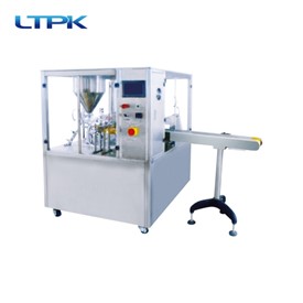 Rotating cup filling and sealing machine