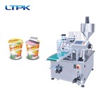 Rotary cup filling and sealing machine
